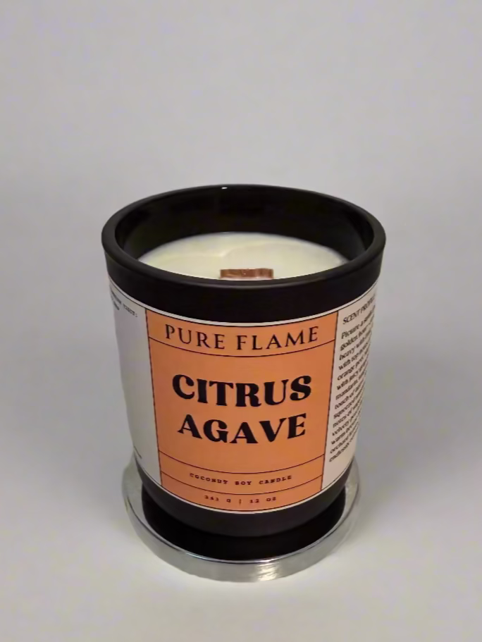 Candle labeled 'Citrus Agave' by 'Pure Flame' on a white surface with a ruler in the background.