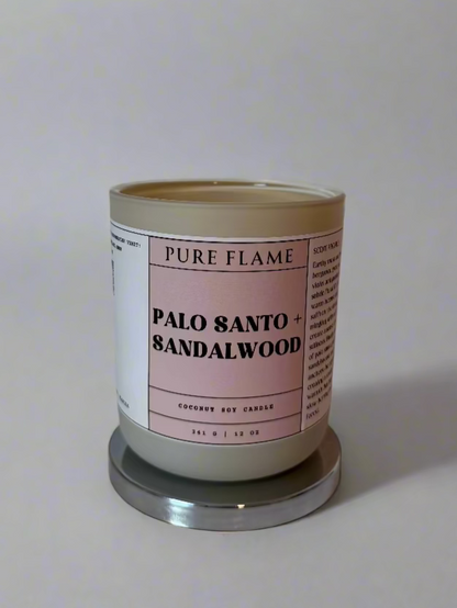 Candle labeled 'Pure Flame' with 'Palo Santo & Sandalwood' on a white surface.